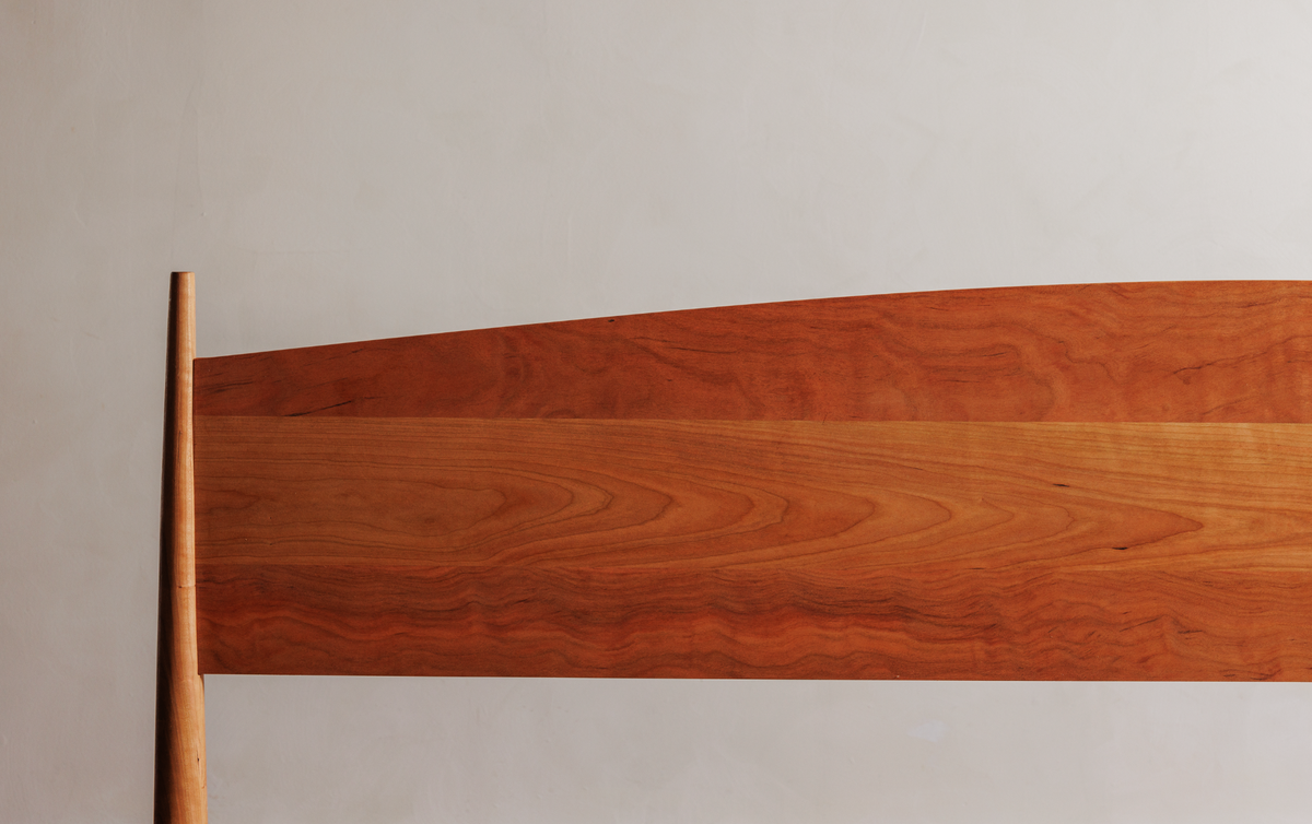 Close up of the cherry wood headboard
